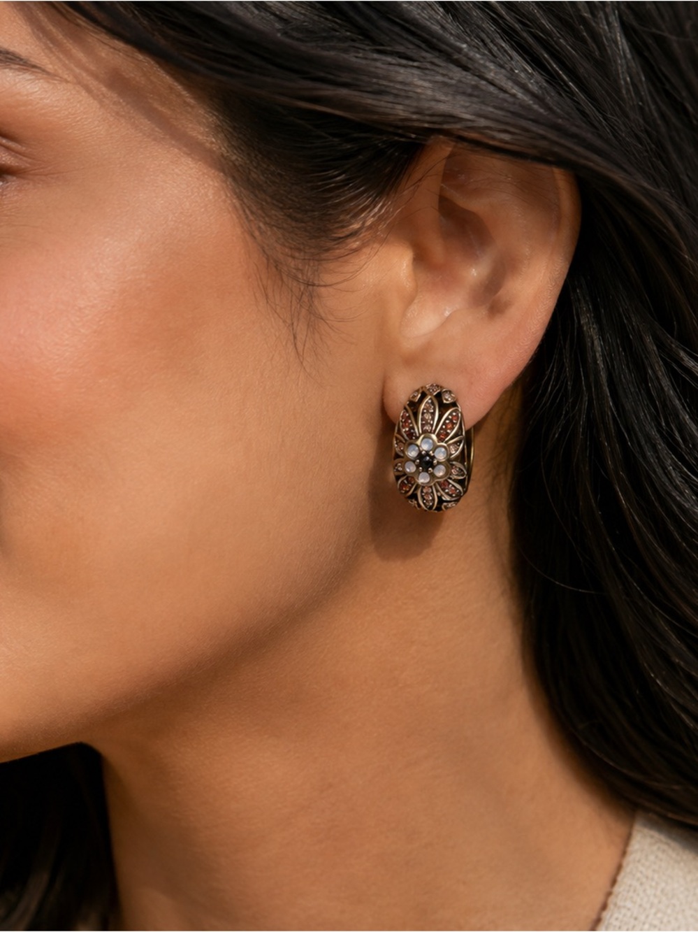 Heidi Daus "Glorious Garden" half-hoop clip-on earrings.